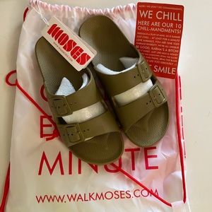NWT. Moses green plastic slides